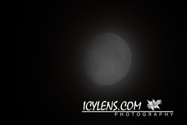 The moon behind the clouds III